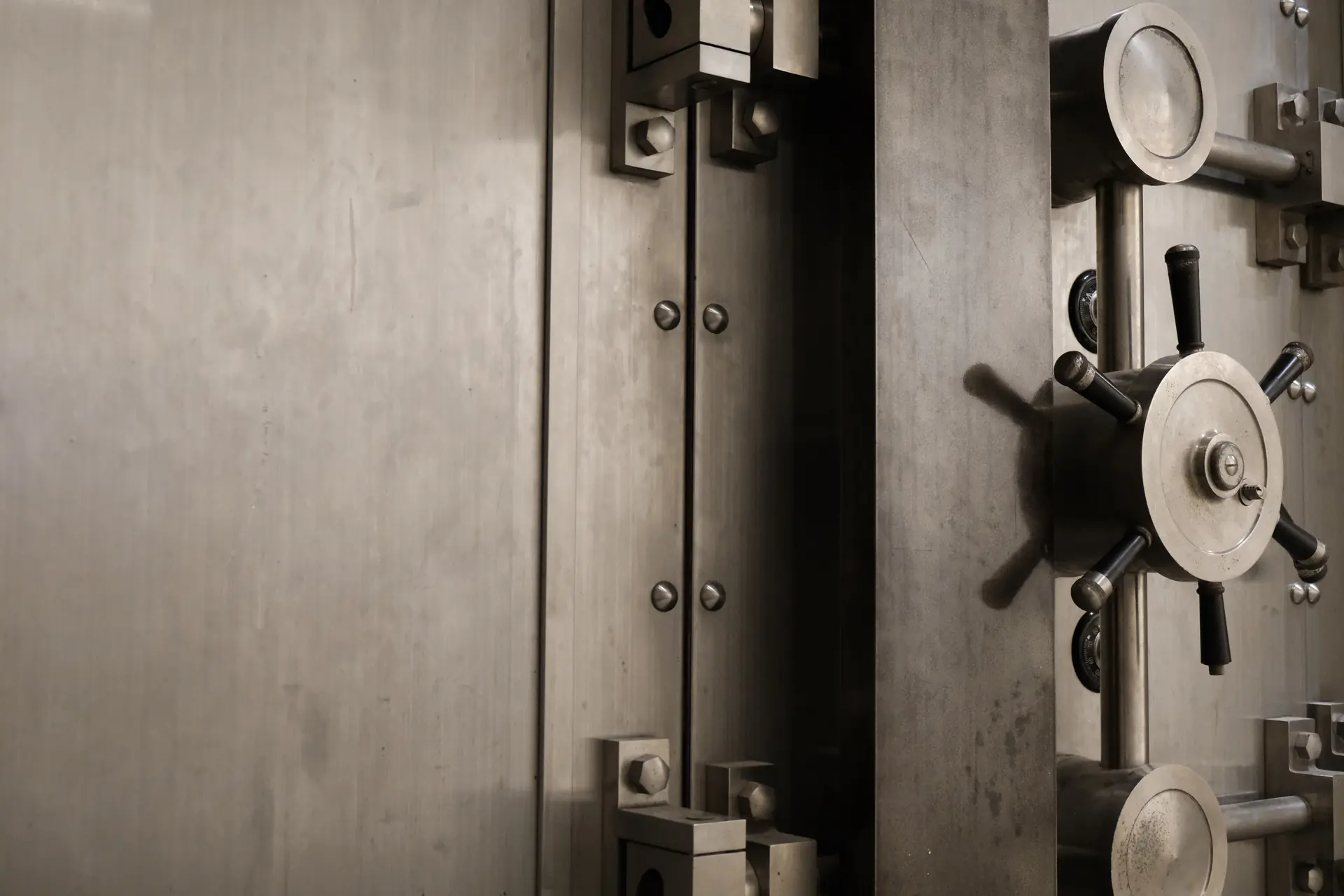 Steel bank vault door with its locking wheel